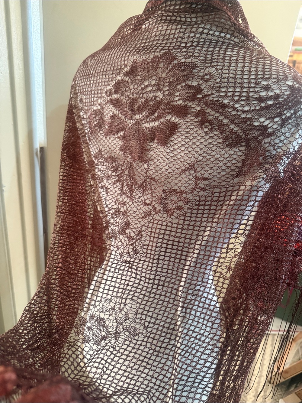 Vintage brown, triangular crocheted lace shawl with a delicate floral geometric